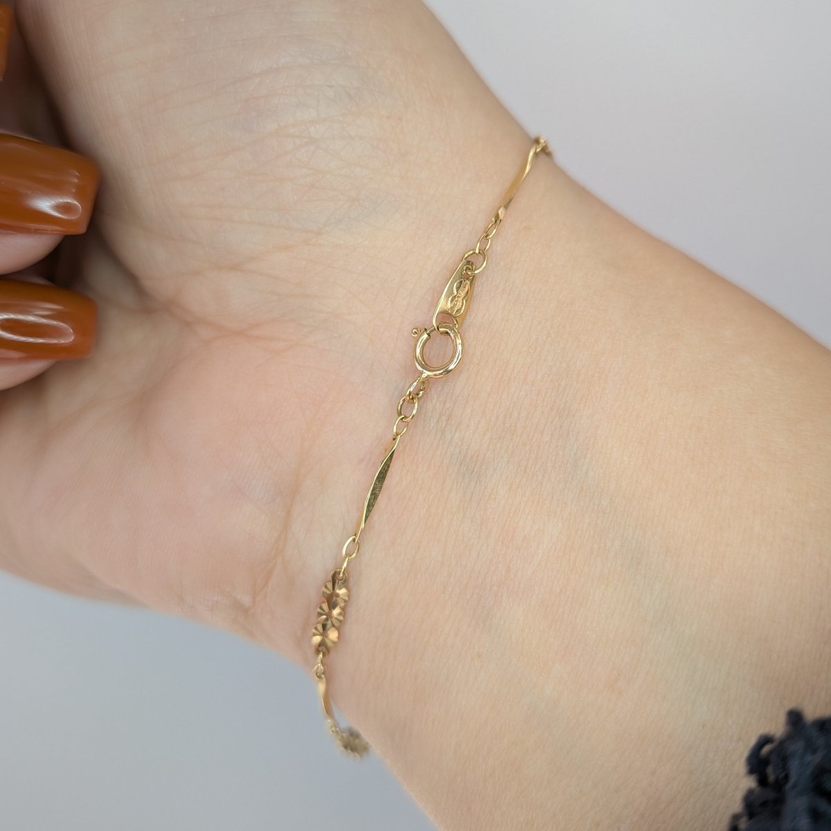 Armband med facetterade ringar 18k guld - Smyckesbanken