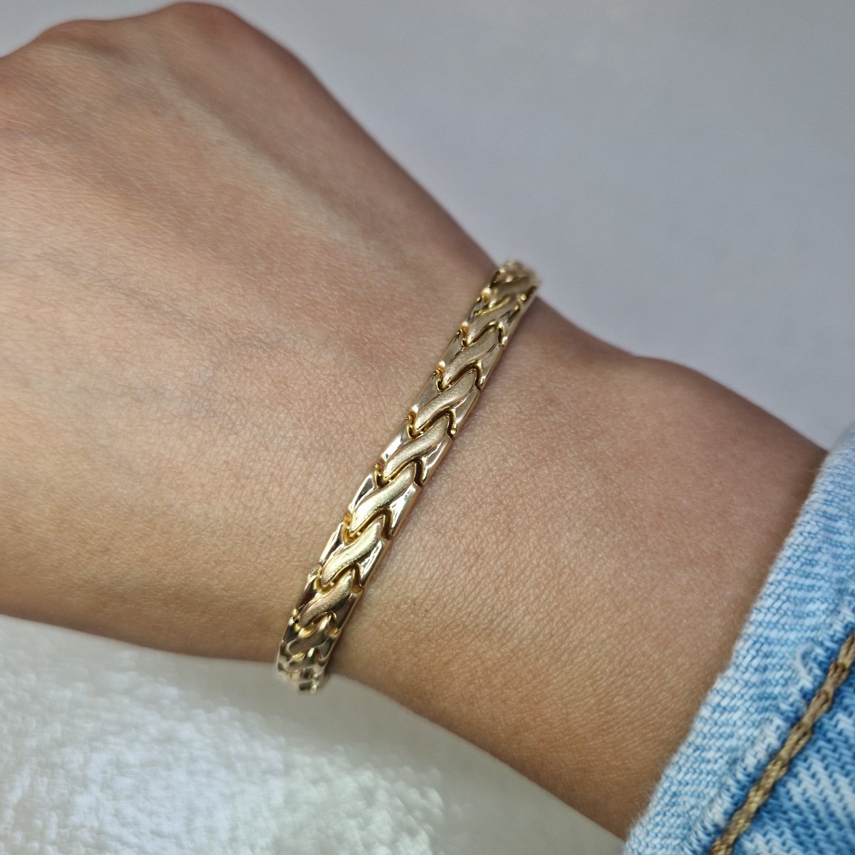 Ledat armband tillverkad i 18 karat guld - Smyckesbanken