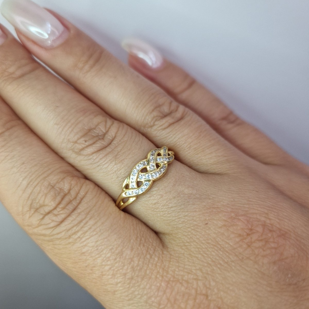 Ring flätad design 18k guld - Smyckesbanken