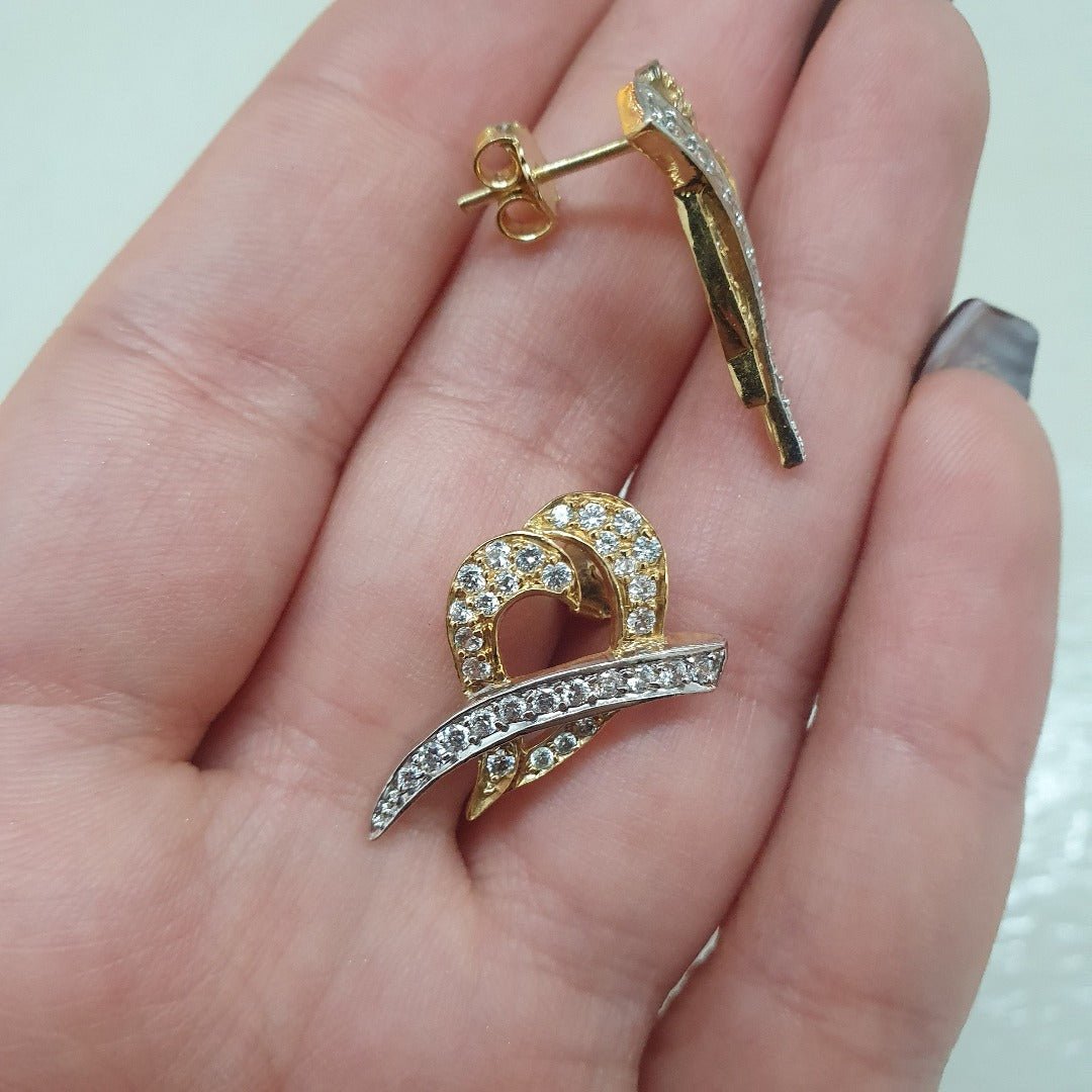 tvåfärgat guld örhängen