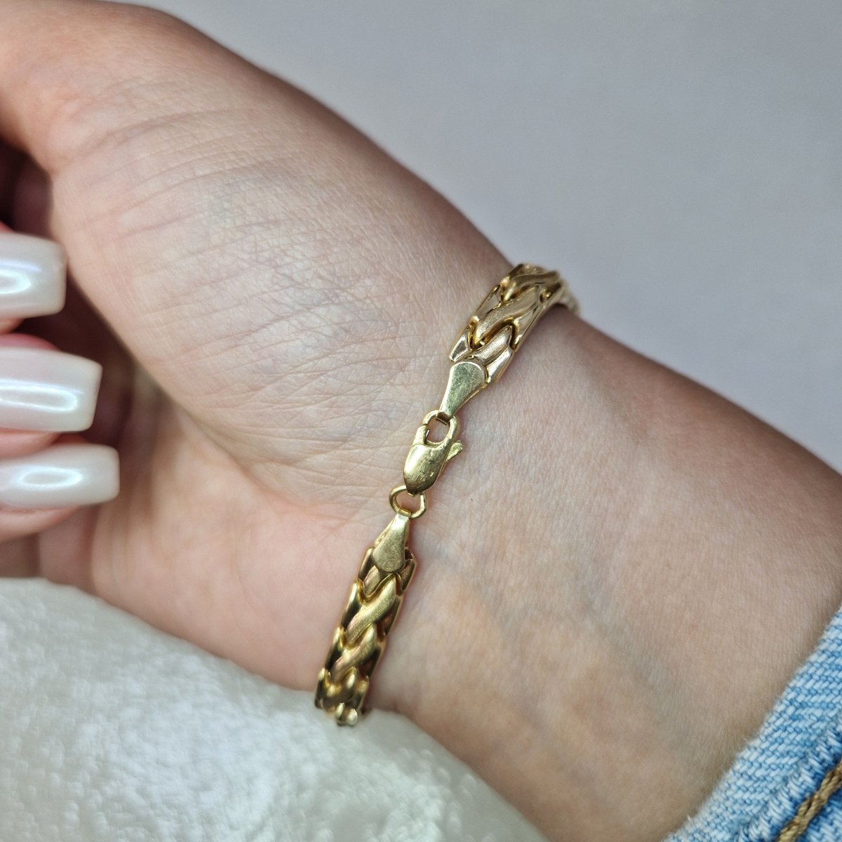 Ledat armband tillverkad i 18 karat guld - Smyckesbanken