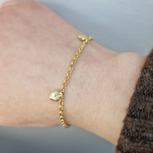 Armband med hjärtan i 18k guld - Smyckesbanken
