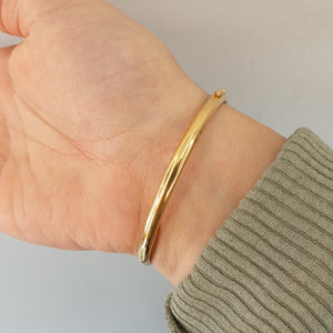 Stelt armband i två färgat 18k guld - Smyckesbanken